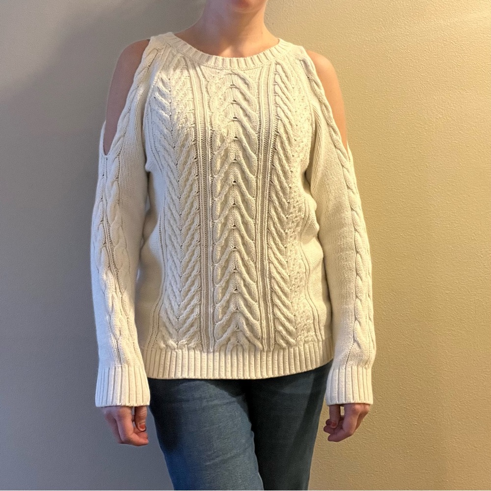 Cream white long sleeved sweater with shoulder cut outs
